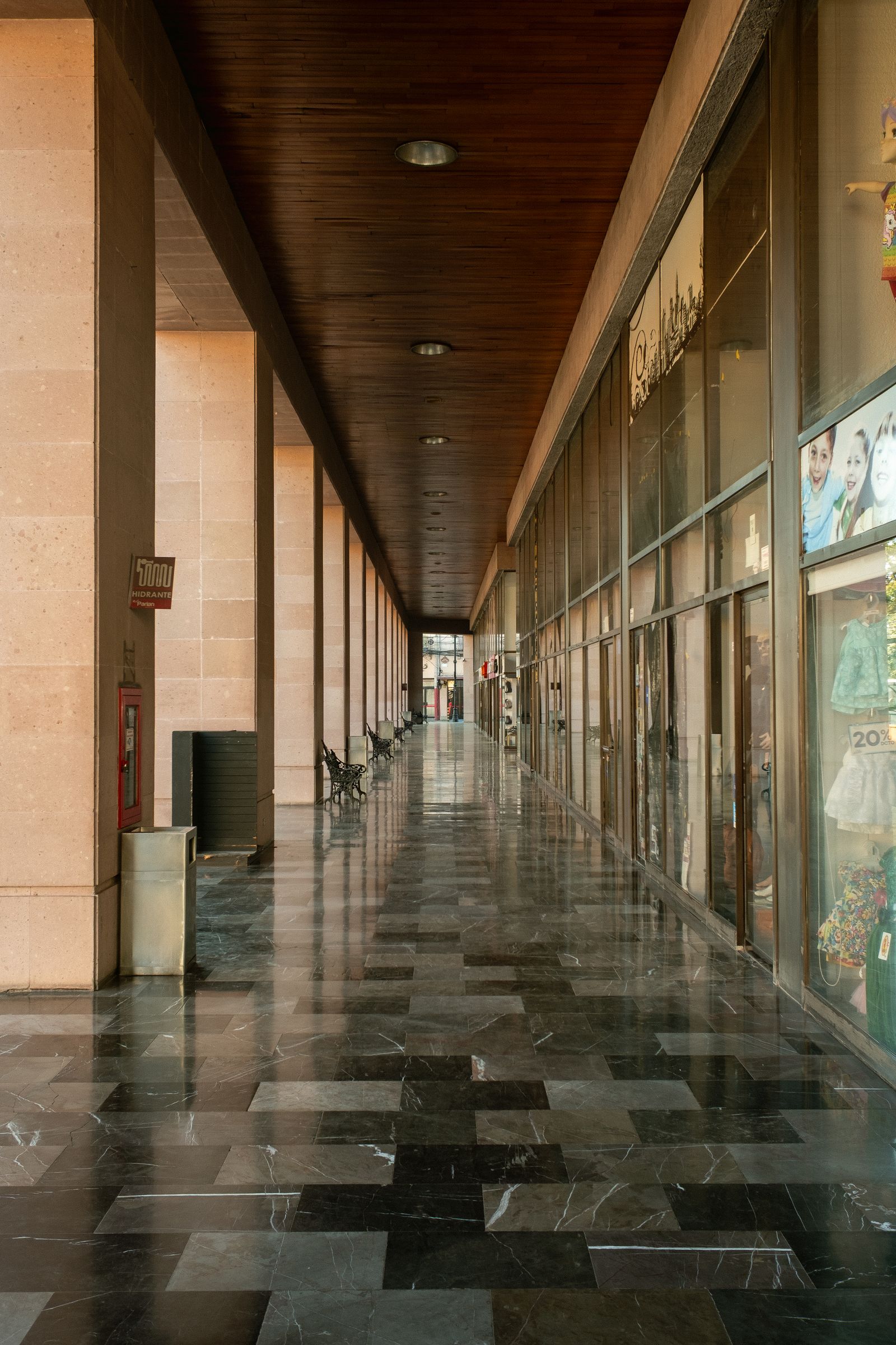 Polished marble floor in a long commercial corridor