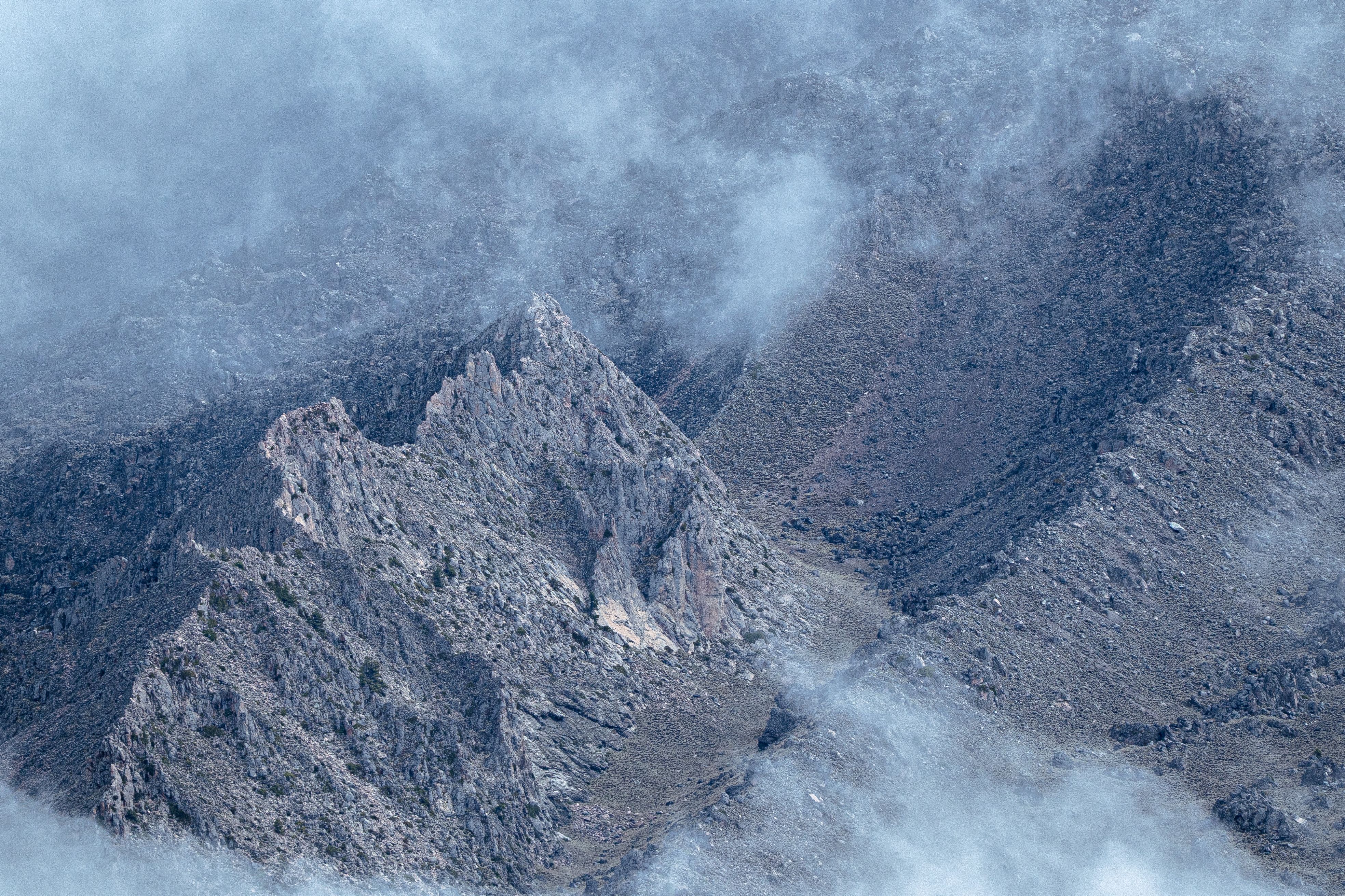 Dramatic Mountain Peaks Shrouded in Mist · Free Stock Photo