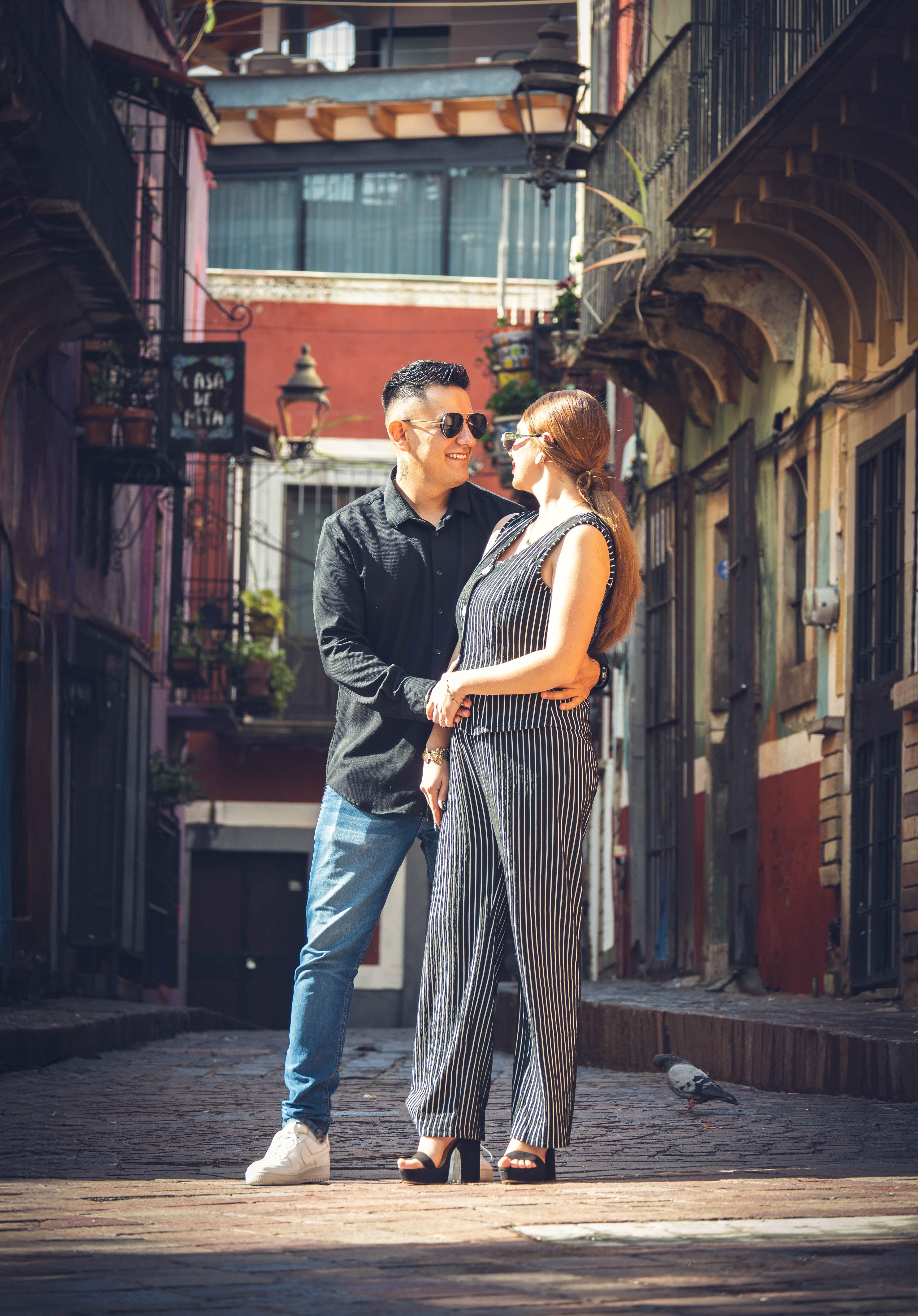 Man and Woman Walking on Street While Holding Hands · Free Stock Photo