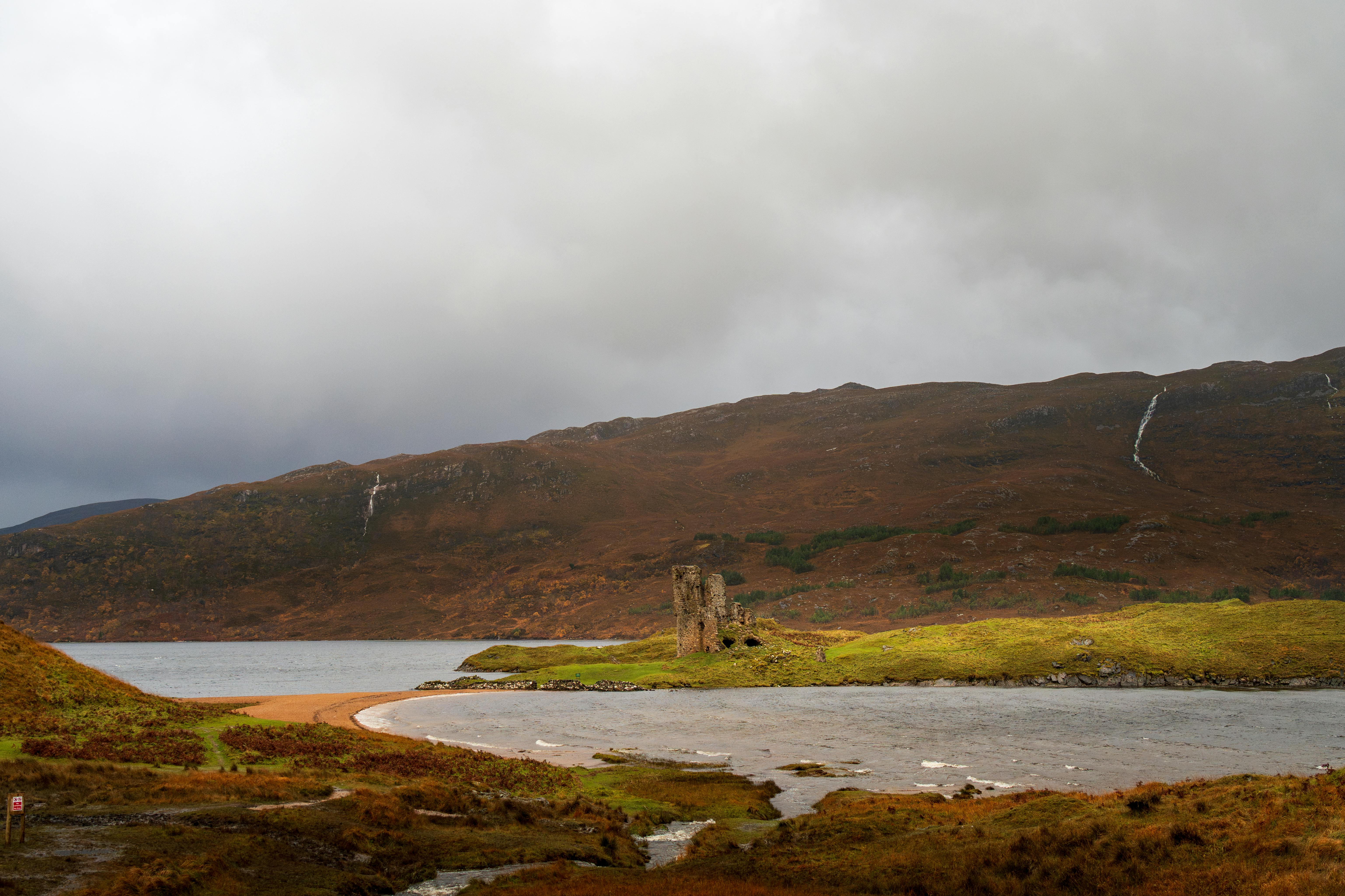 Stunning autumn view of Ardvreck Castle ruins on Loch Assynt, Scotland.