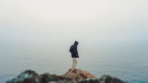 Man Standing on Sea Cliff