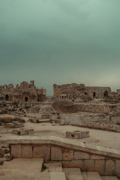 Free Explore the ancient historical ruins of Aleppo, Syria captured under a dramatic cloudy sky. Stock Photo