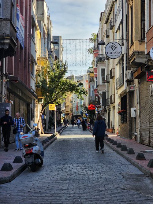 Free Explore a bustling street in Beyoglu, Istanbul, with historic architecture and lively atmosphere. Stock Photo