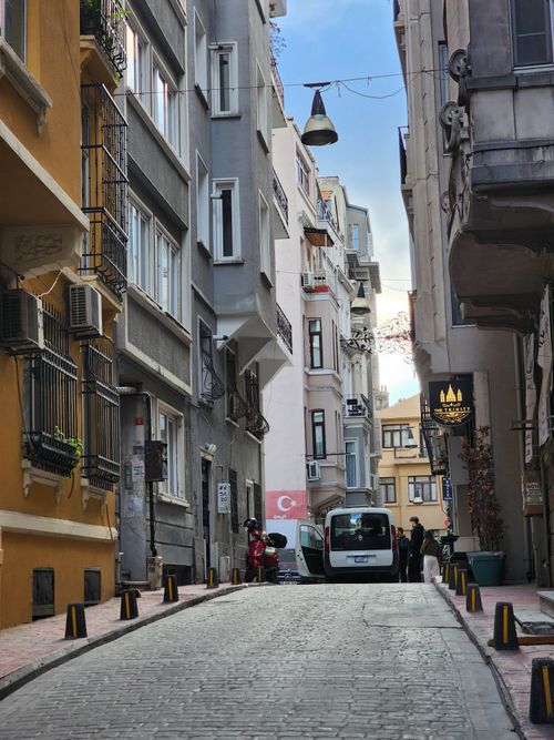 Free Charming alleyway in Istanbul with narrow cobblestone street and historic buildings. Stock Photo