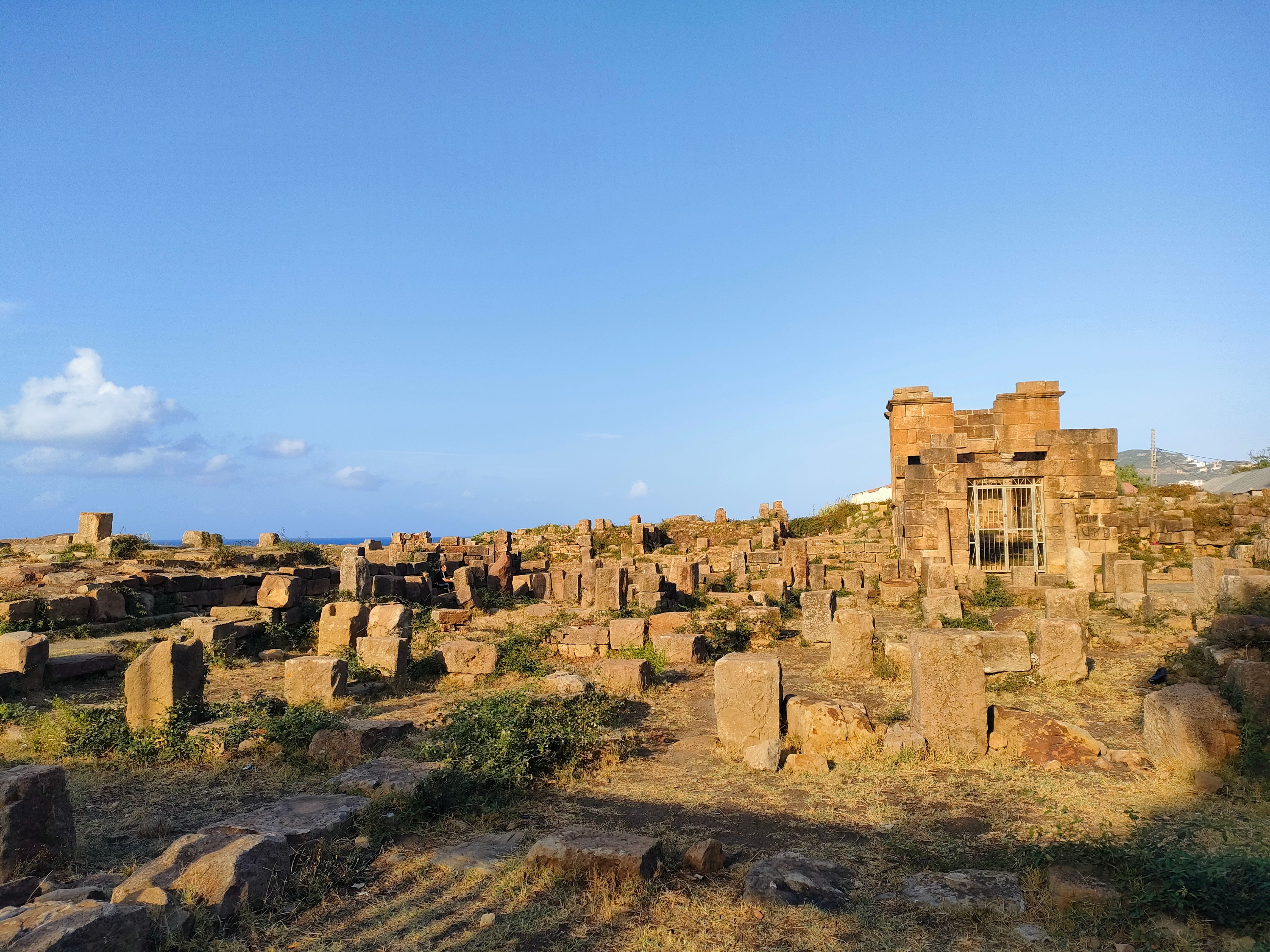 Explore ancient Roman ruins in Tigzirt, capturing the essence of Algerian history.