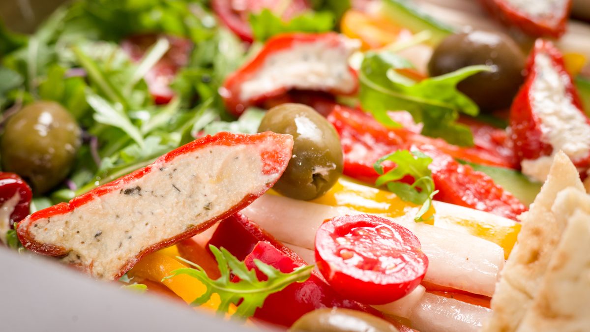 Labneh plate with red bell pepper and olives