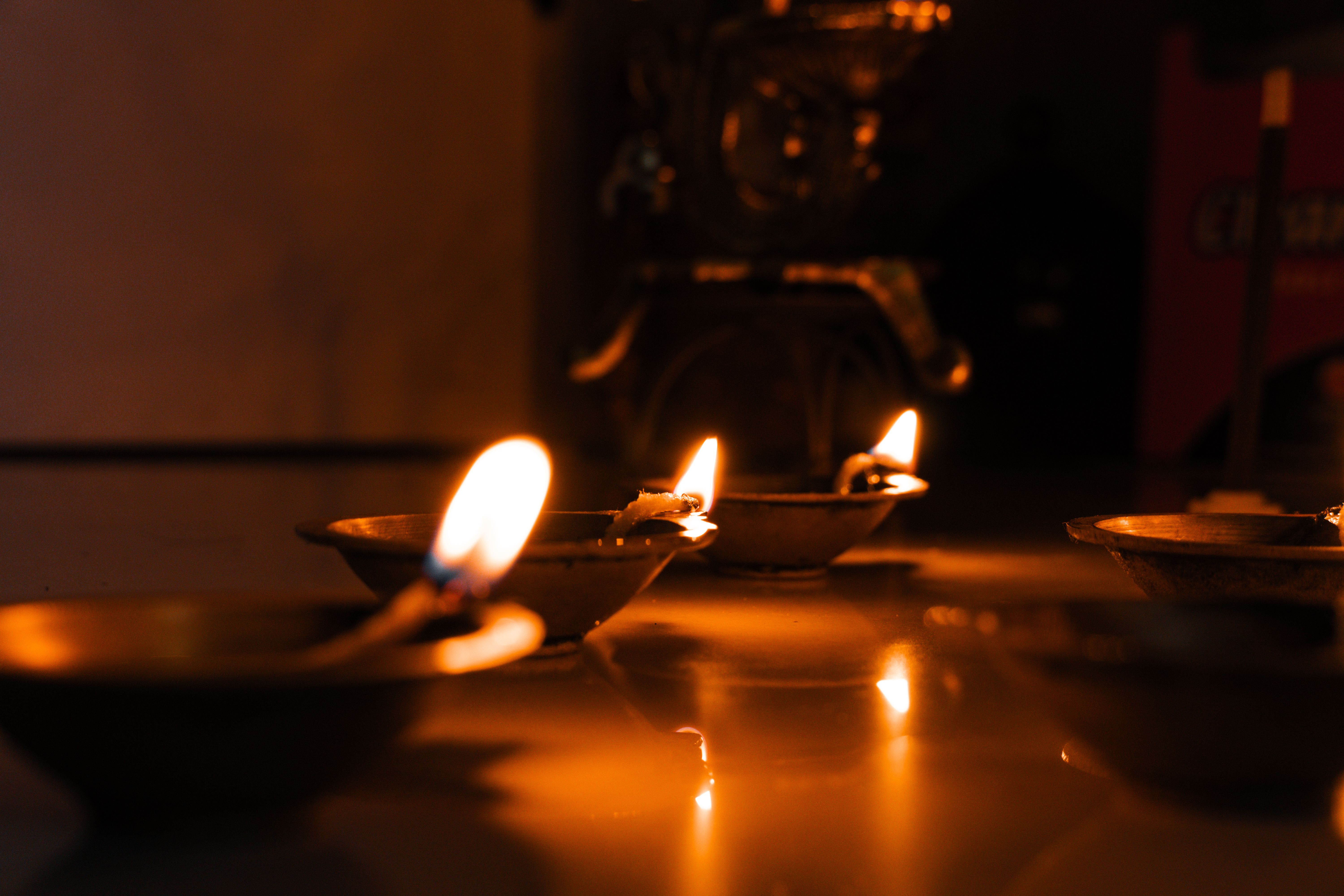 Diwali lights on a Gurugram apartment tower with diyas on balconies