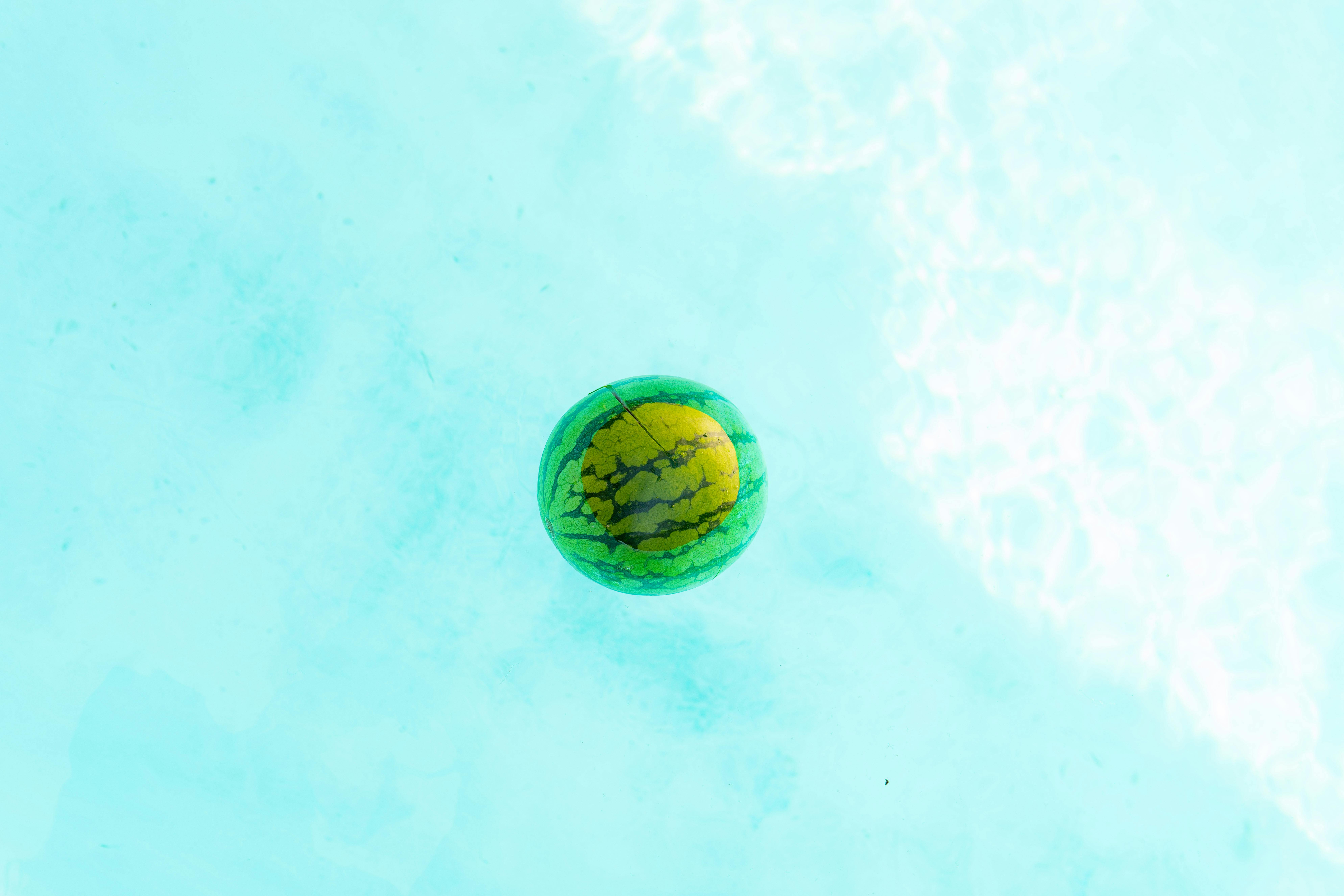 A Watermelon Floating on Water · Free Stock Photo
