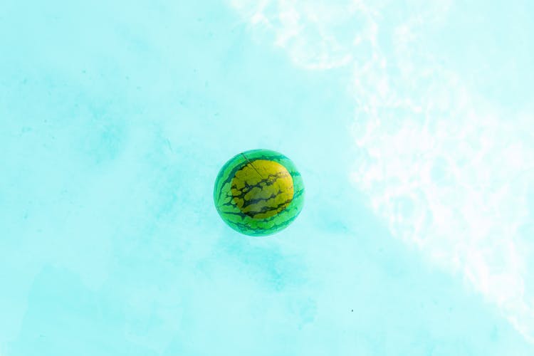 A Watermelon Floating On Water