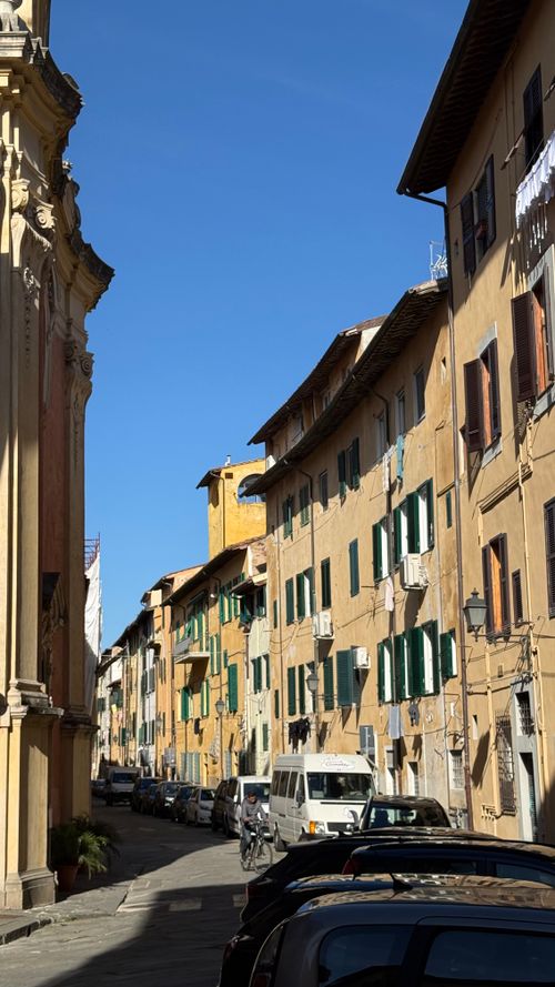 Free Sunny day street scene in Italy showcasing classic architecture. Stock Photo