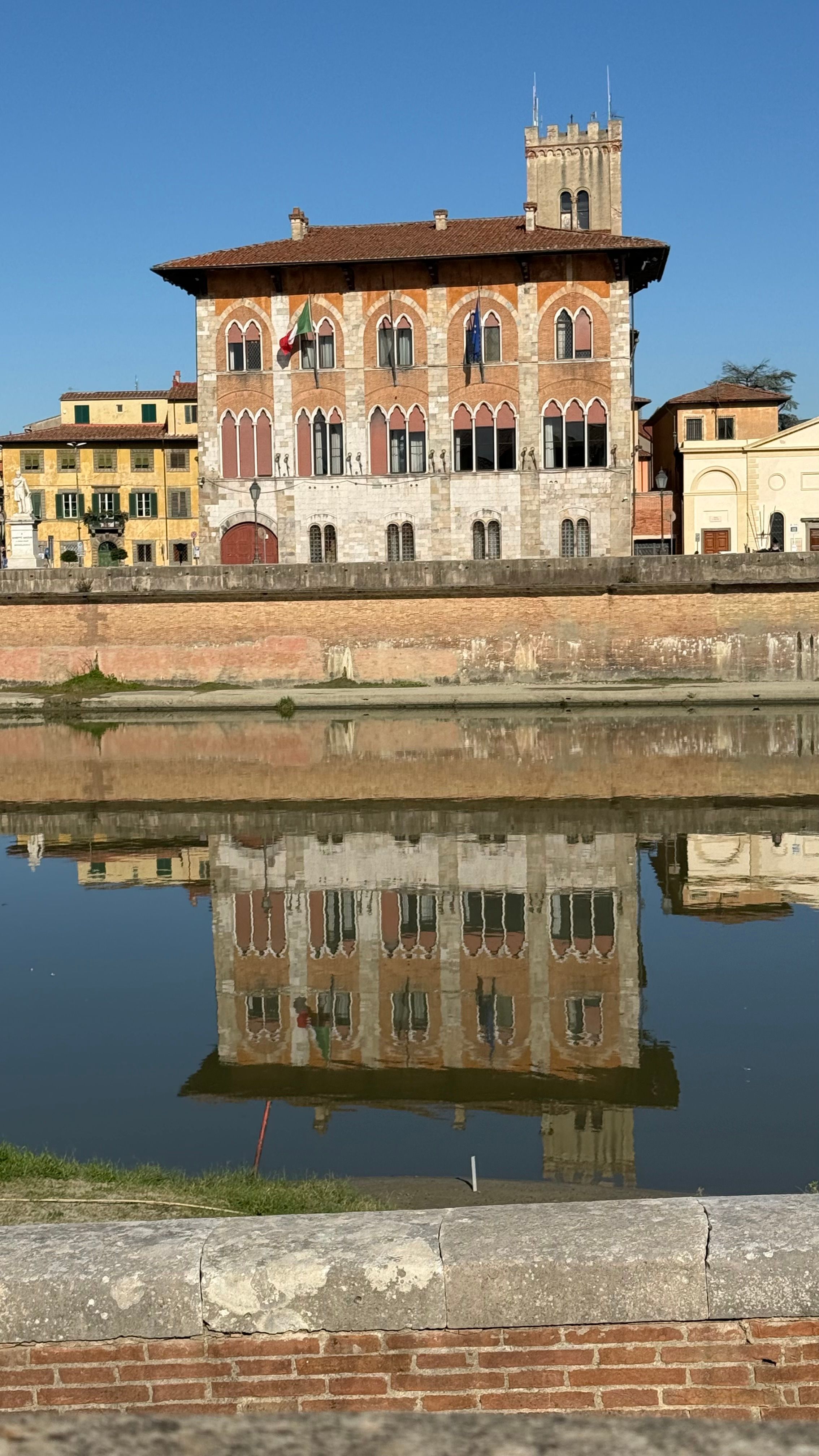 Historic Italian Building Reflecting in River · Free Stock Photo
