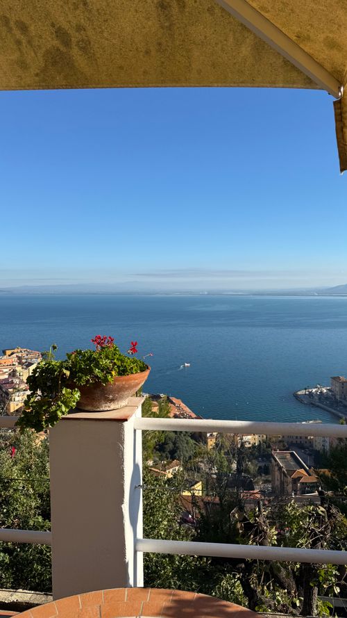 Free Breathtaking view from a terrace overlooking the sea and coastal town on a clear sunny day. Stock Photo