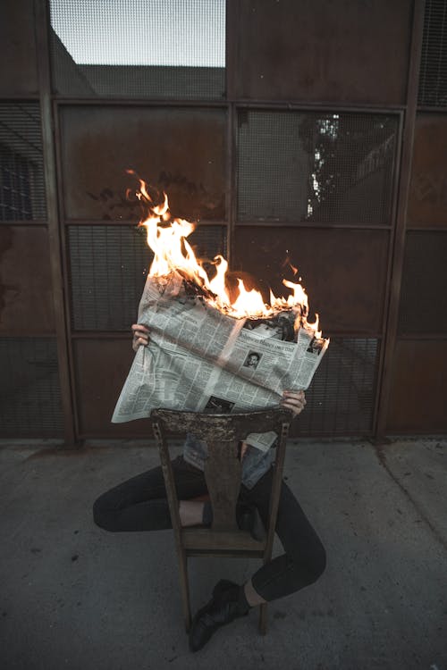 Free Burning Newspaper Stock Photo