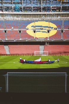 Vibrant soccer stadium with flag ceremony in full display, emphasizing team spirit.
