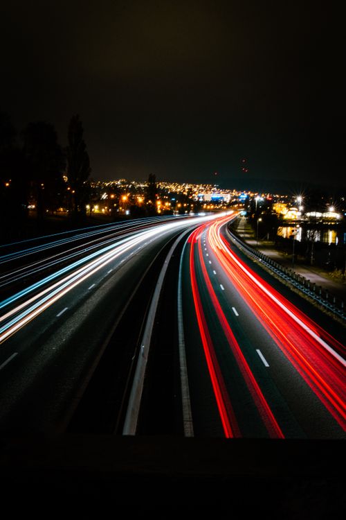 Free A stunning long exposure capture of a busy highway in Huskvarna, Sweden at night. Stock Photo