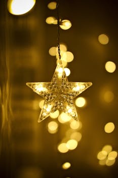 Warm glowing star ornament with golden bokeh lights creating a festive ambiance.