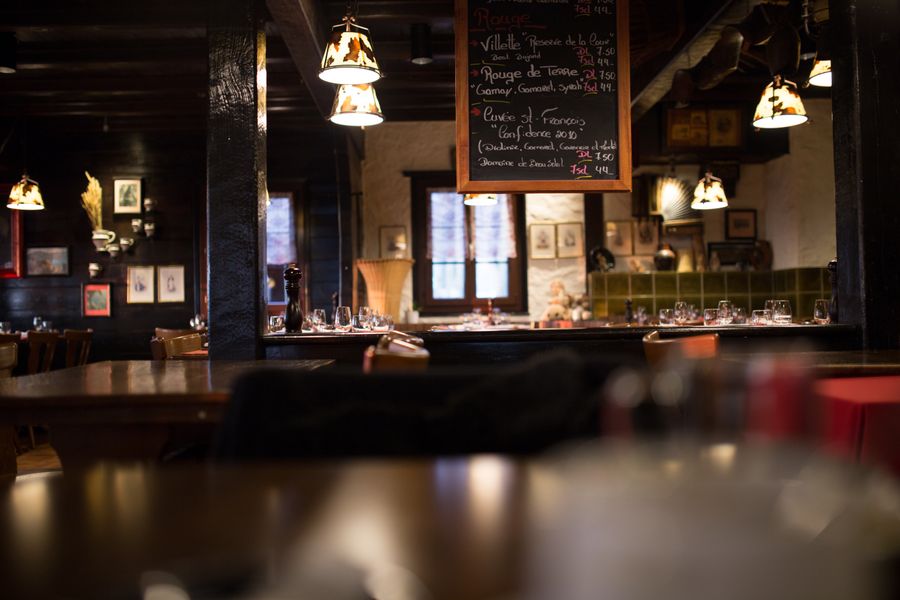 Warm vintage restaurant interior with wooden furnishings