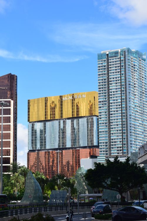 Free View of modern skyscrapers in Macau with clear blue skies, showcasing urban architecture. Stock Photo
