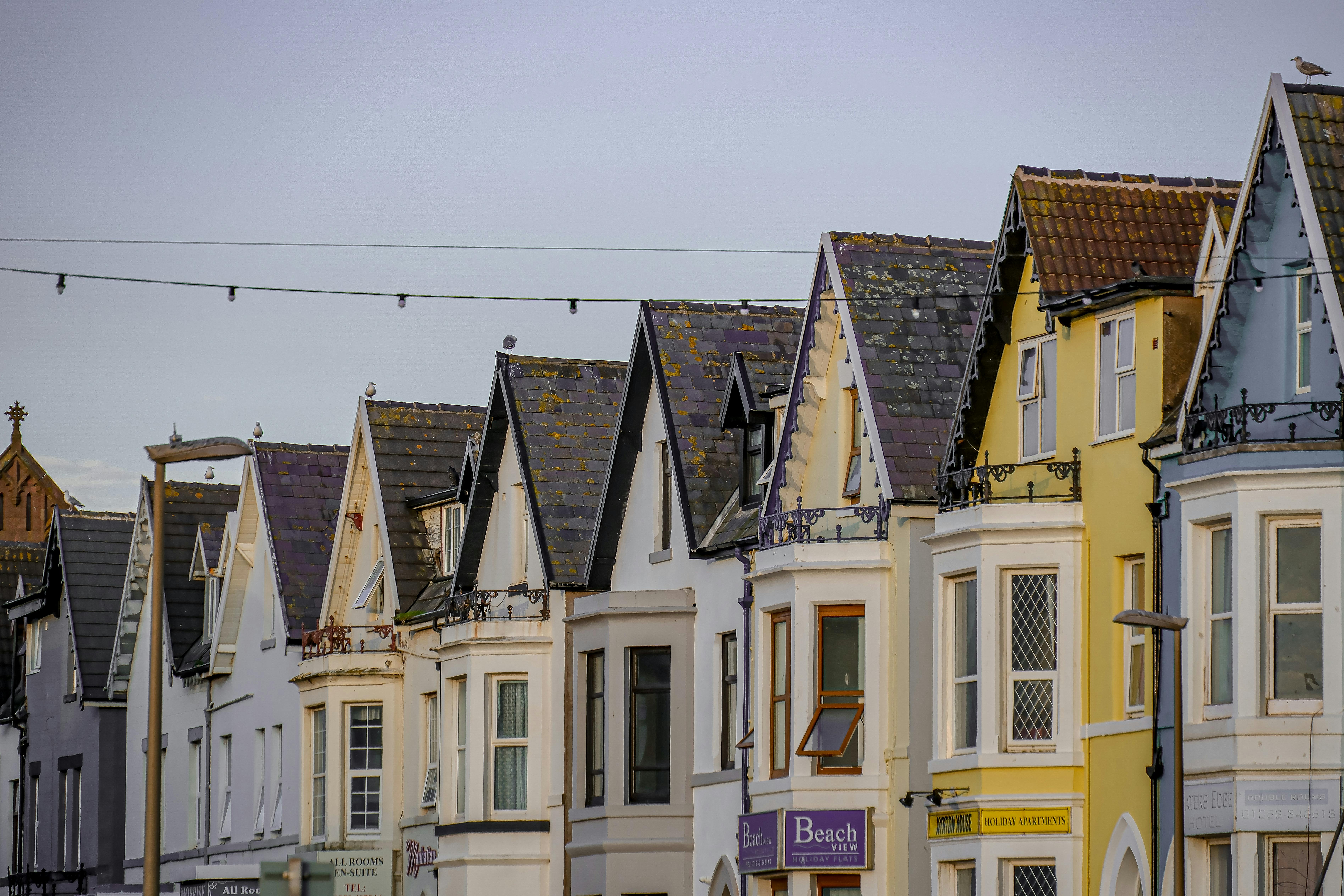 Colorful row houses in Blackpool, showcasing Edwardian architecture during a serene day.