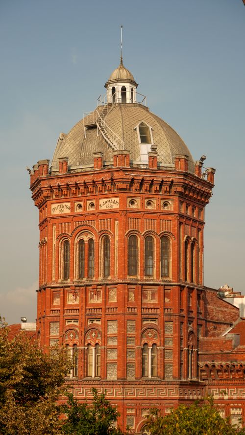 Free Red brick circular building with dome, ornate architecture, in bright daylight. Stock Photo