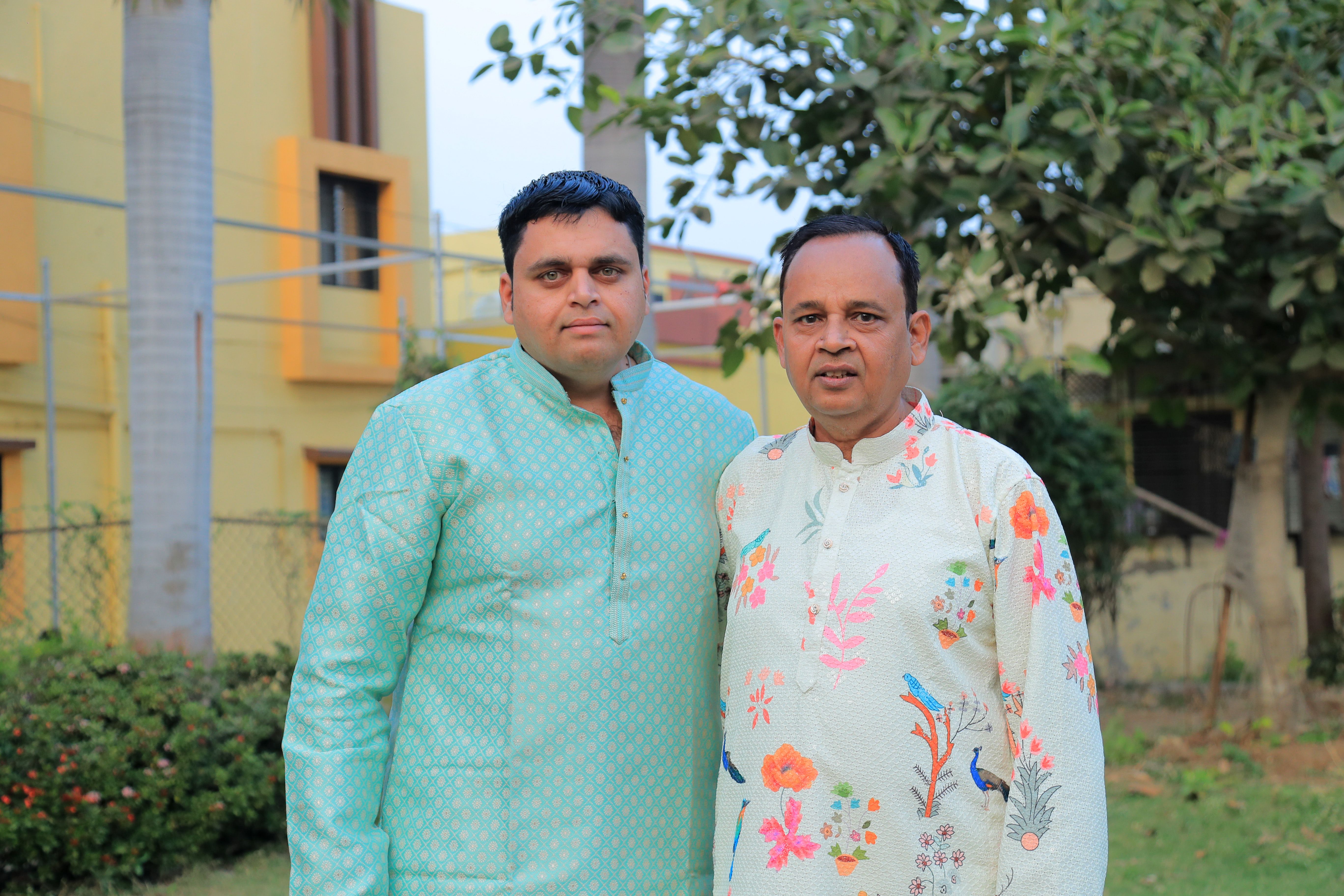 Two Men in Traditional Attire Posing Outdoors · Free Stock Photo