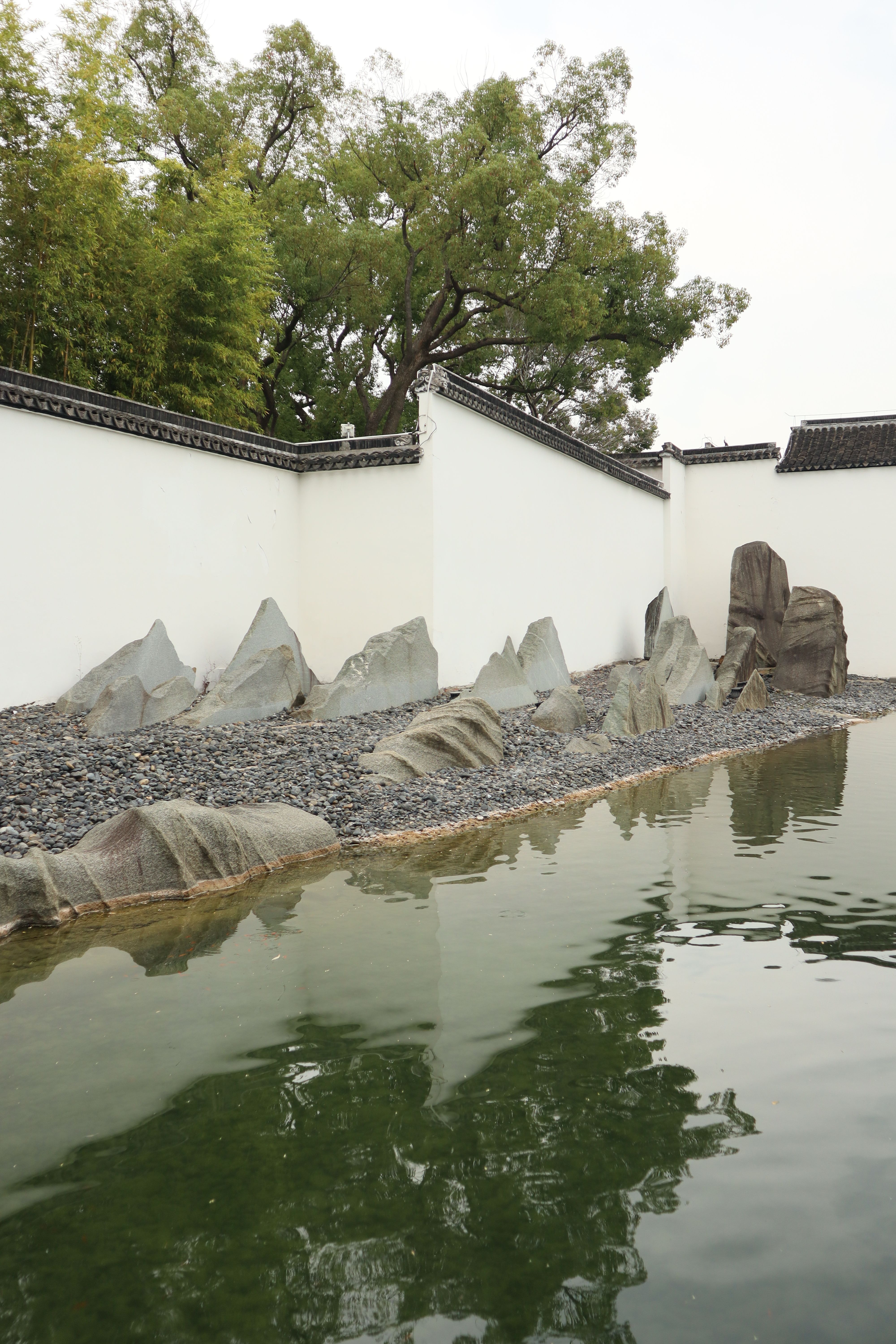 Serene Zen Garden with Reflective Pond · Free Stock Photo