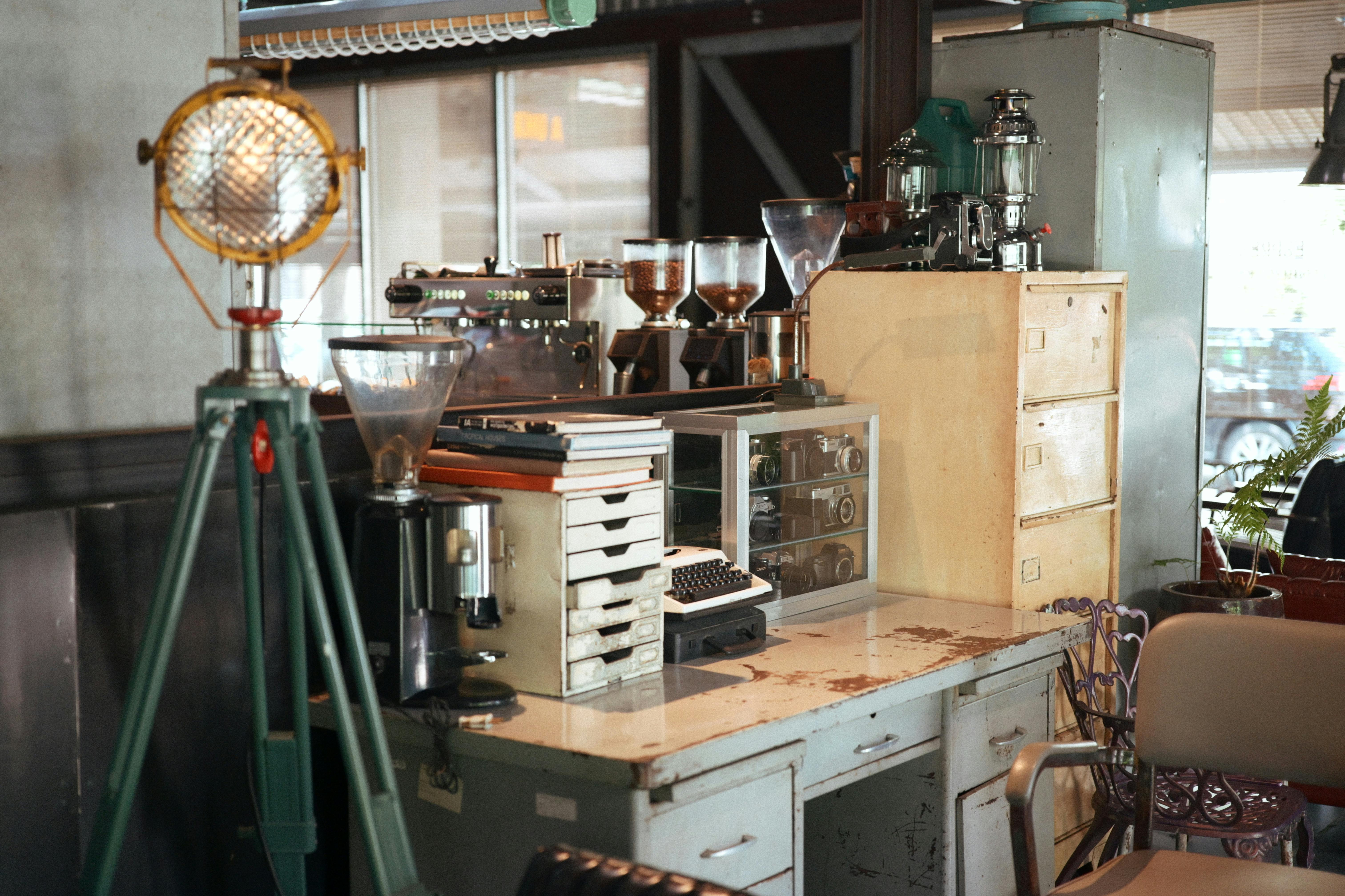 Cozy coffee shop corner with vintage decor and retro equipment, perfect for a classic vibe.