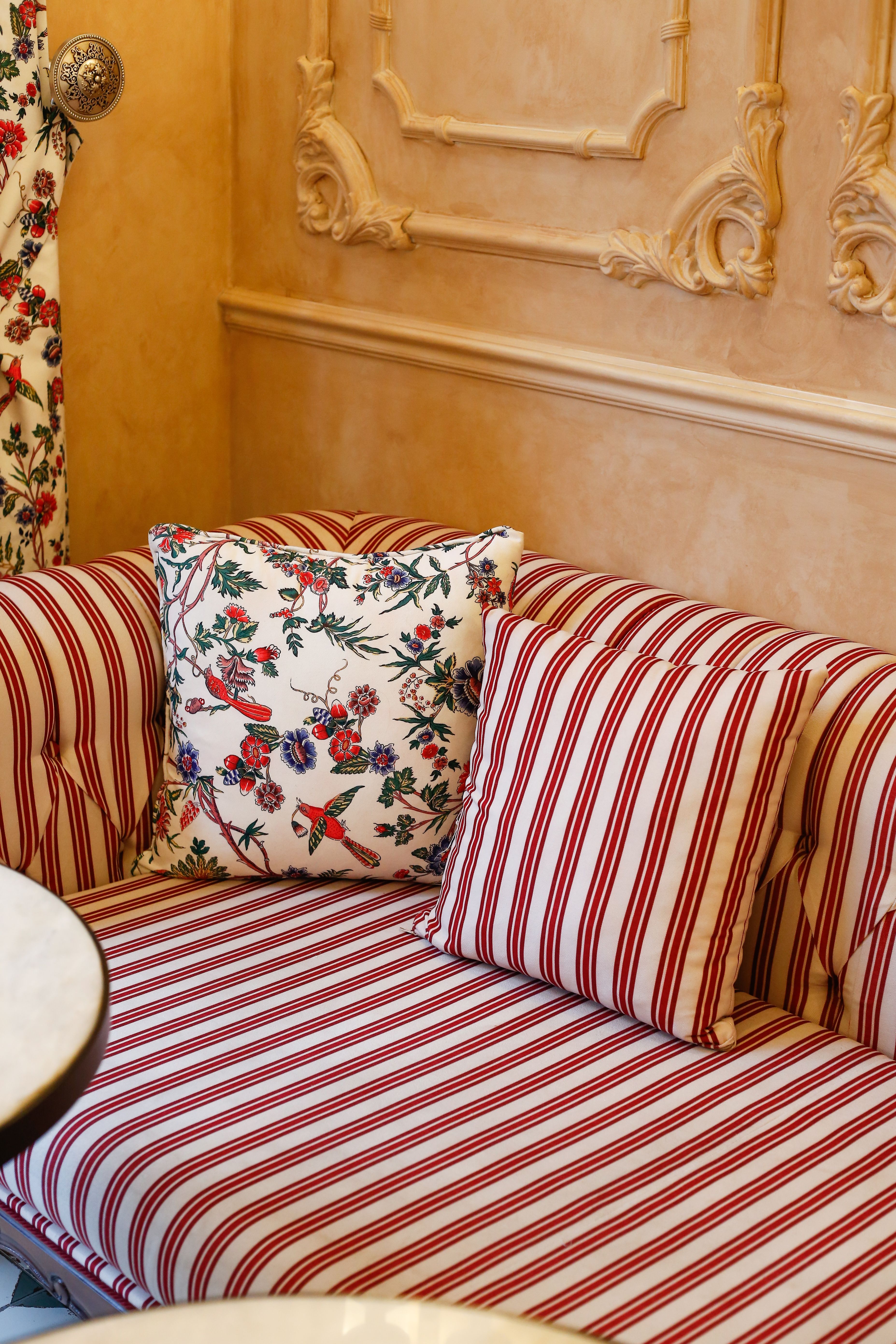 Elegant Striped Sofa with Patterned Cushions · Free Stock Photo