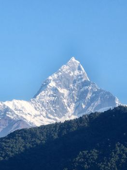 A breathtaking view of Machapuchare peak with clear blue skies from Pokhara, Nepal. 34655582