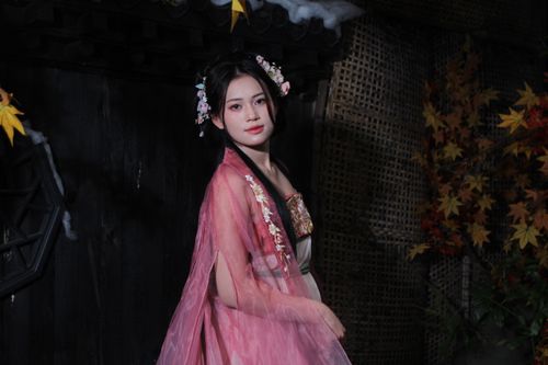 Free Woman in traditional dress with floral headpiece, in a culturally themed setting. Stock Photo