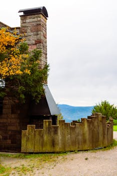Captivating rustic home with a brick chimney and scenic mountain view in Baden-Württemberg, Germany.