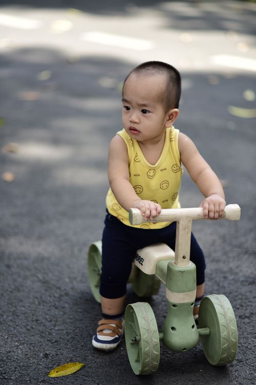 Child riding the Trailblazer Pedal Trike outdoors