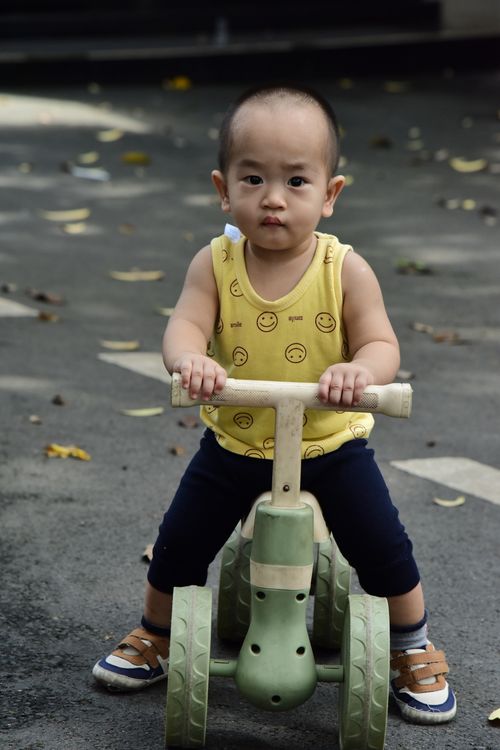Child riding the Explorer Tricycle outdoors