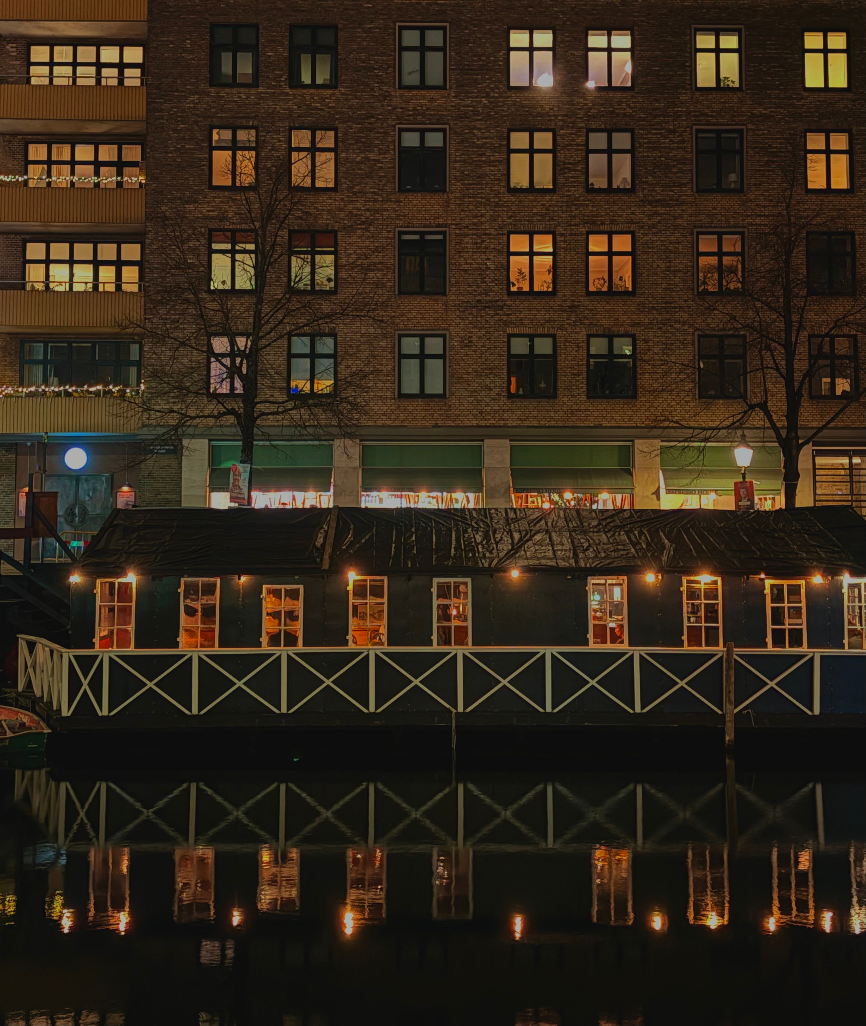 Charming Riverside Building at Night · Free Stock Photo