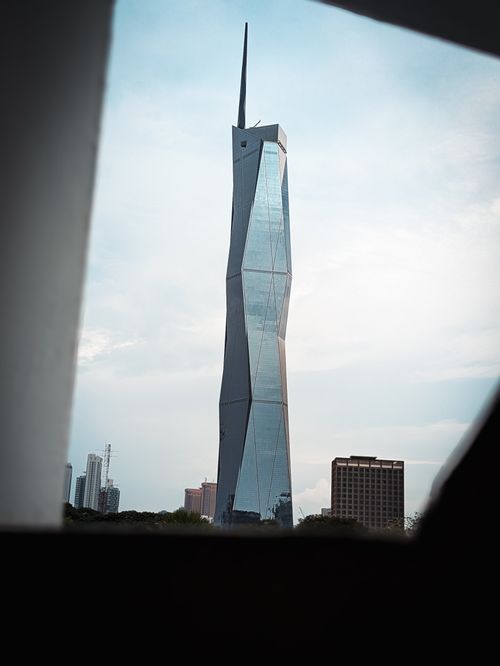 Free Impressive skyscraper silhouette framed against a bright sky, showcasing modern architectural marvel. Stock Photo