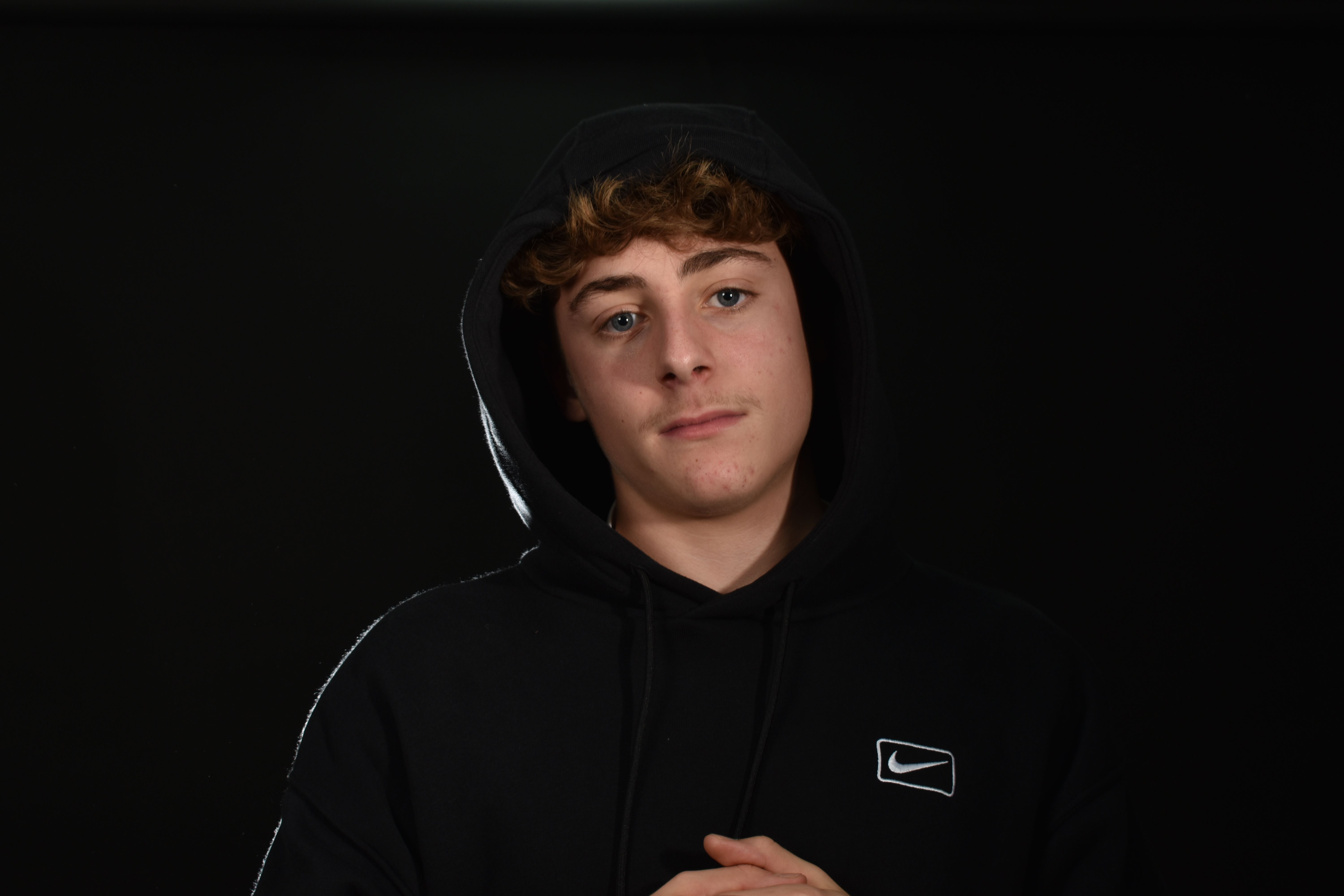 Portrait of Young Man in Black Hoodie · Free Stock Photo
