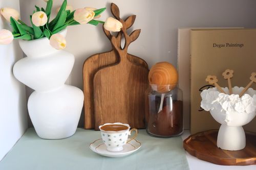 Free Aesthetic still life showcasing a coffee setup with tulips and cutting boards. Perfect for home decor themes. Stock Photo