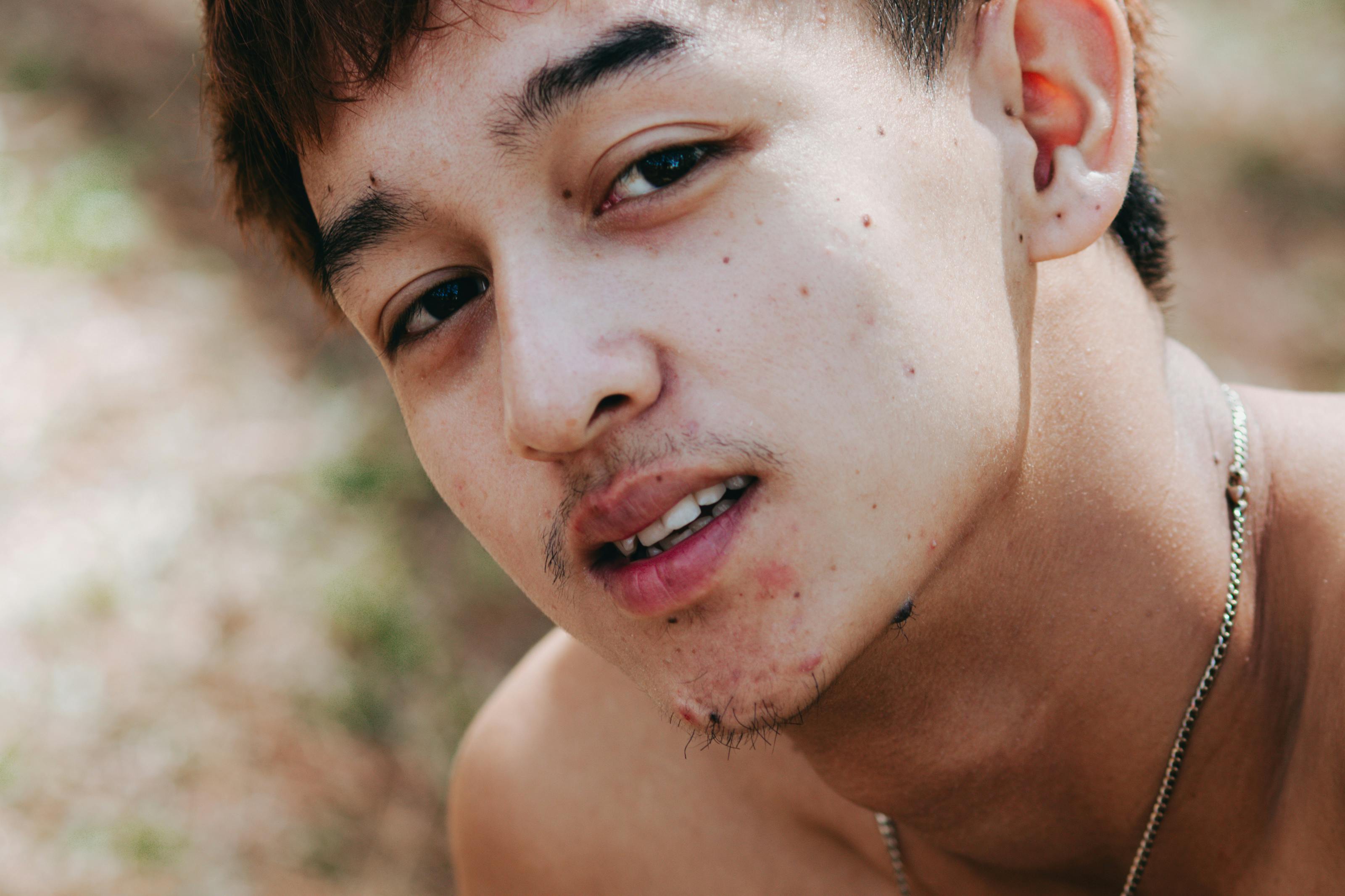Close-up Portrait of Young Man Outdoors · Free Stock Photo