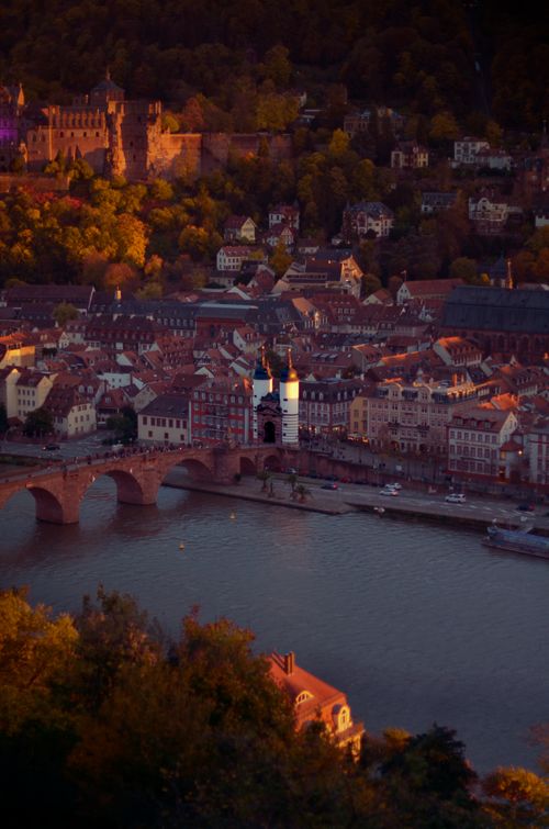 Free Stunning aerial photo capturing Heidelberg's historic center and Neckar River at sunset. Stock Photo