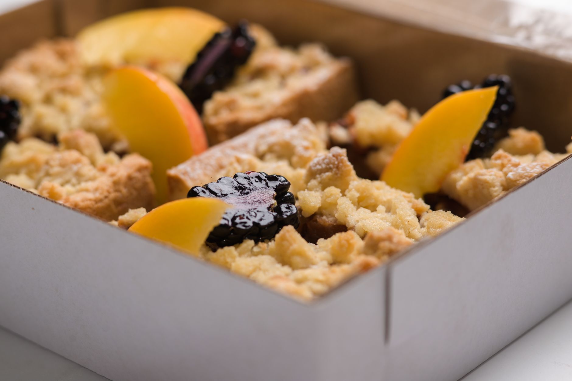 Chunky blackberry and peanut butter crumble baking in skillet