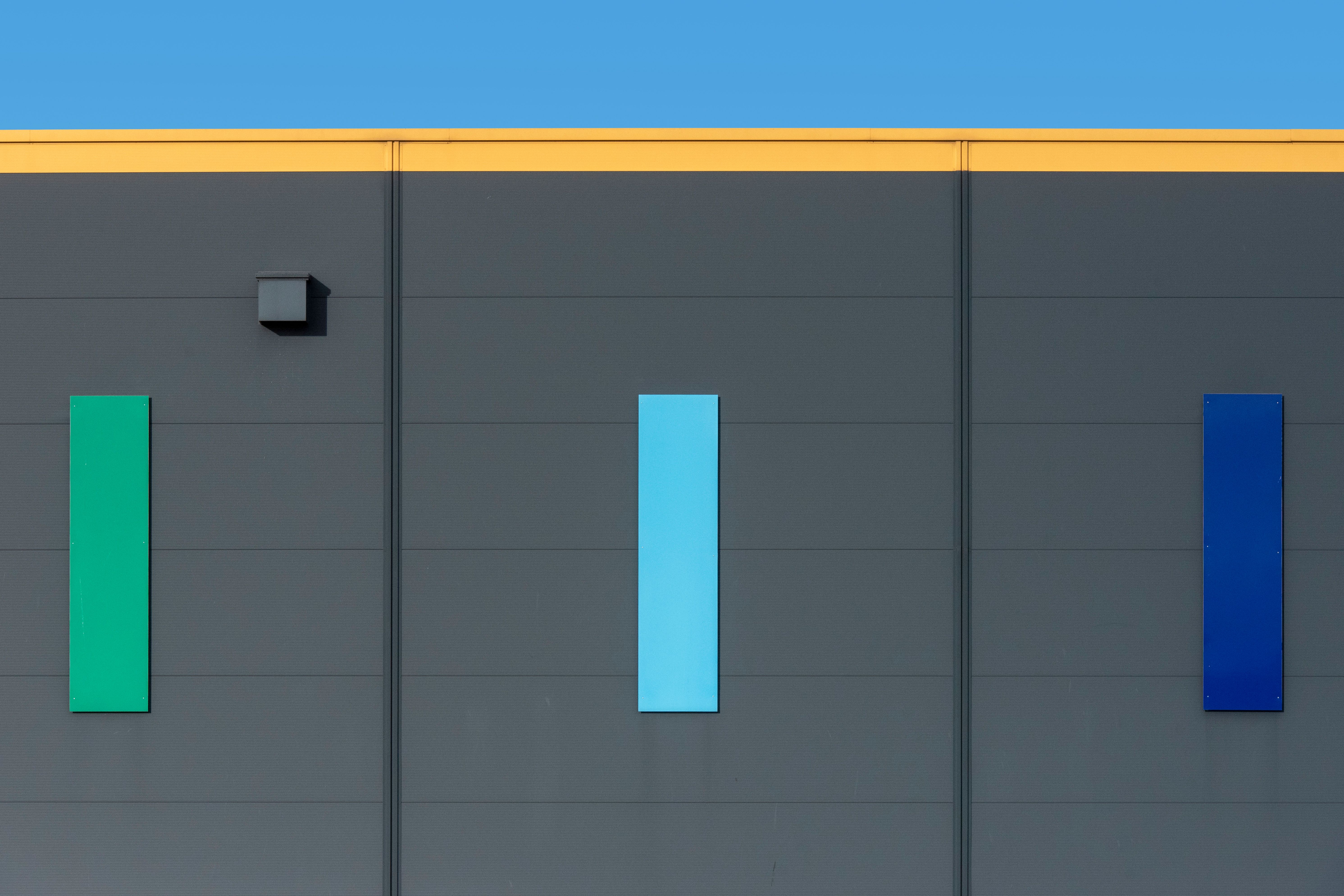Modern Industrial Building with Blue Facade · Free Stock Photo