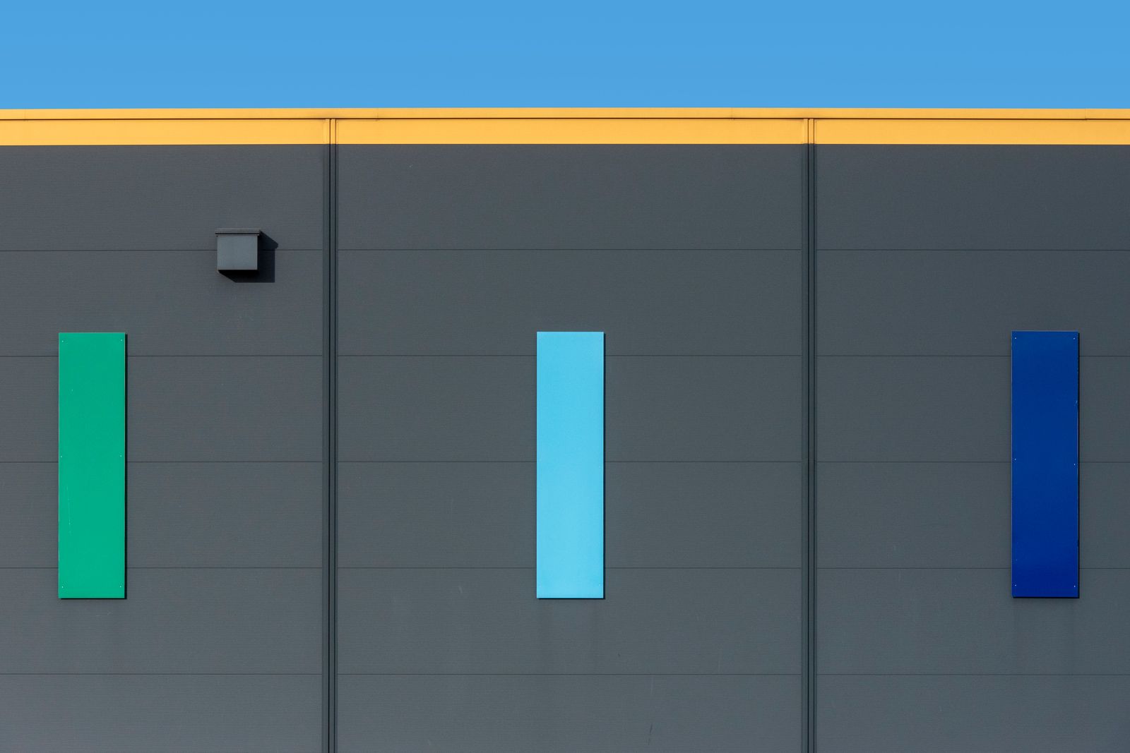Modern Industrial Building with Blue Facade · Free Stock Photo