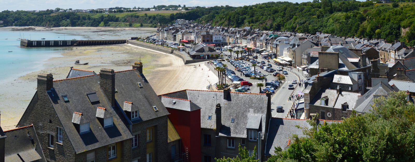 Aerial view of the seaside town of Cancale in Brittany, France, showcasing its picturesque coastline and architecture.