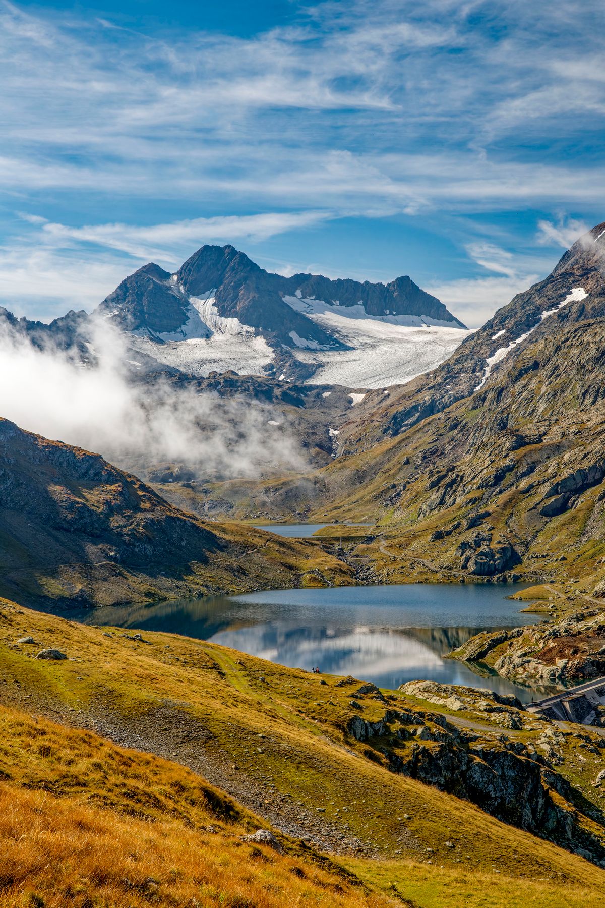 A glacial lake beneath a hanging glacier in the French Alps