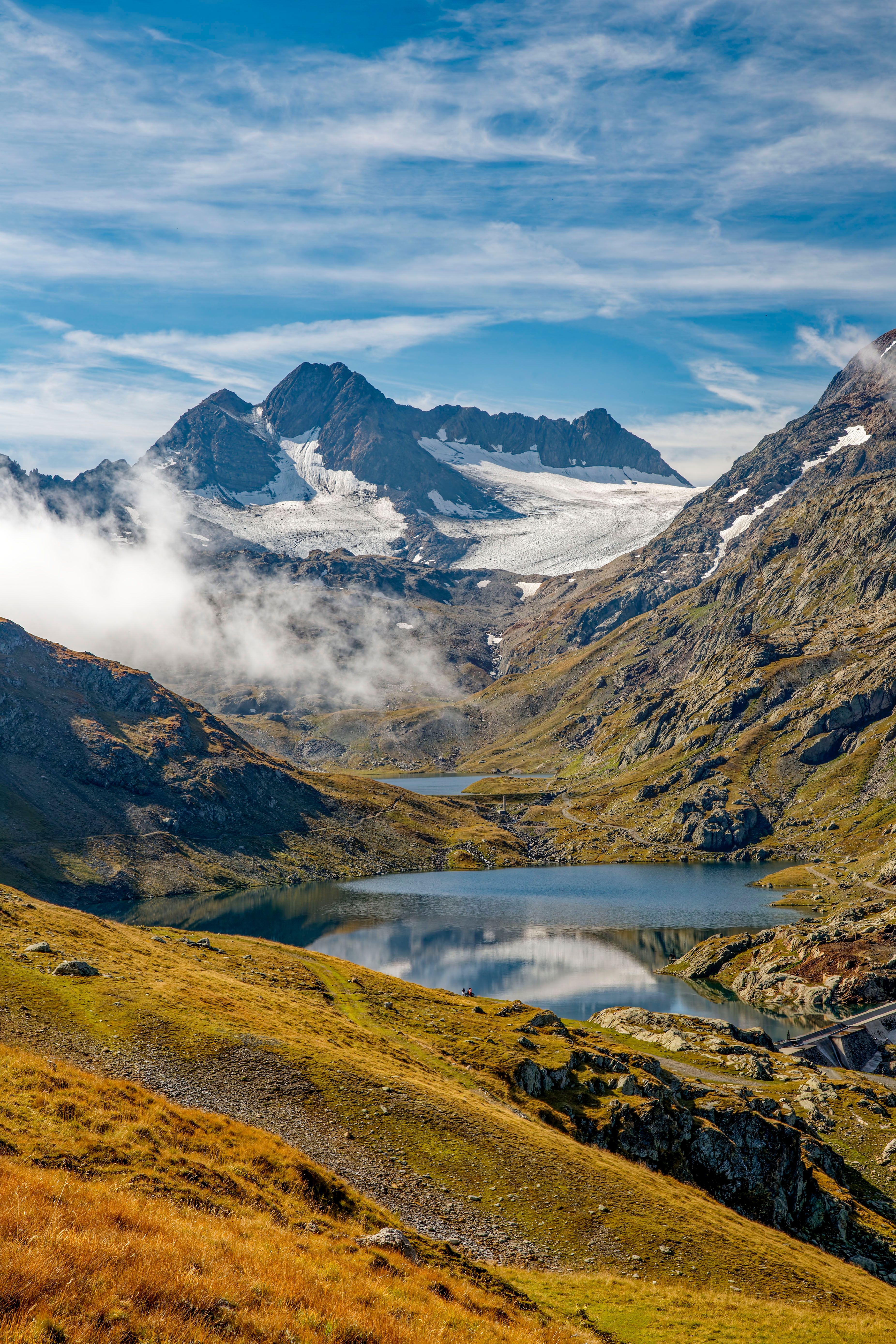 Scenic Alpine Landscape with Snowy Peaks and Lakes · Free Stock Photo