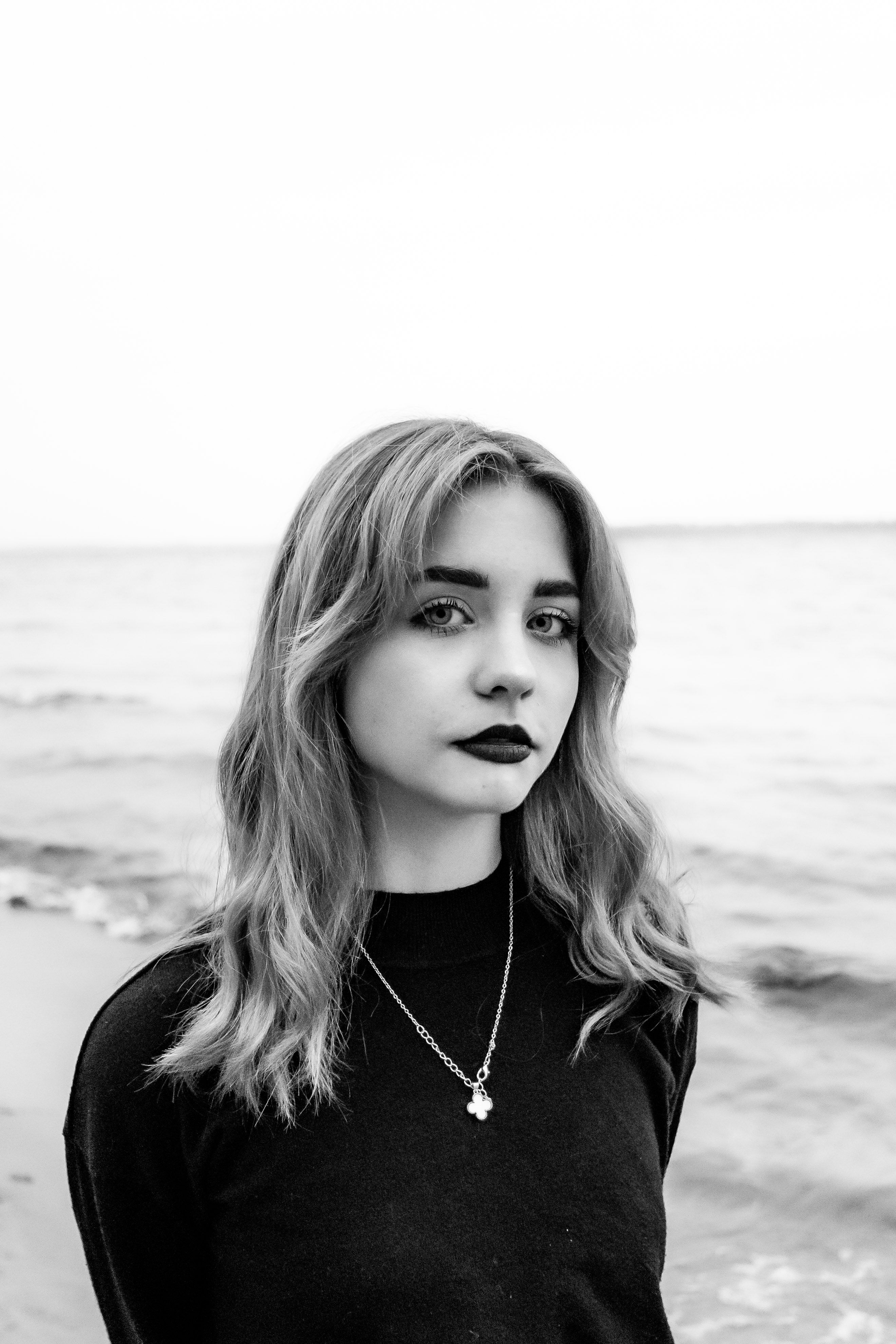 Black and White Portrait of a Young Woman at the Beach · Free Stock Photo