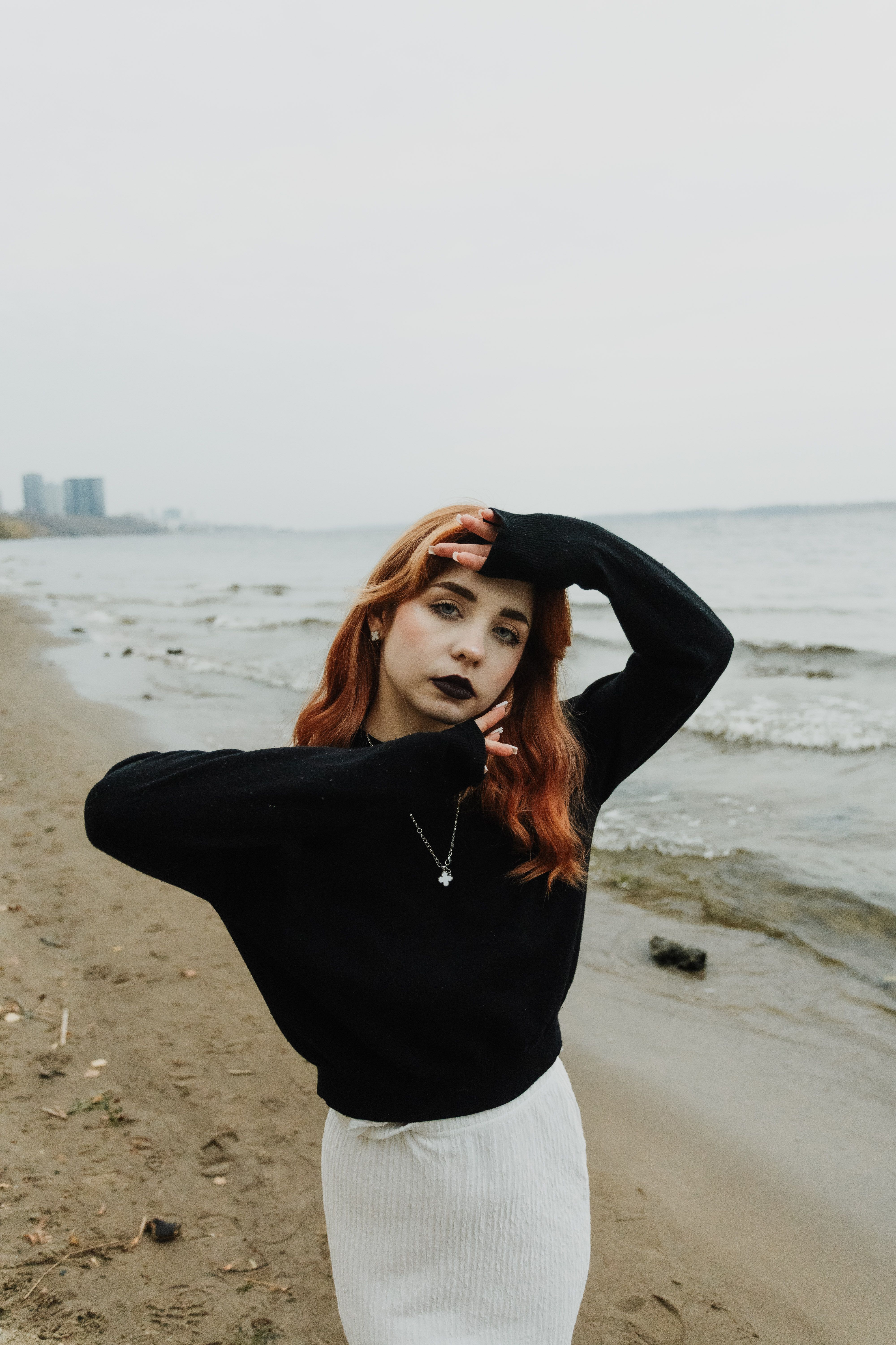Stylish young woman posing on a beach · Free Stock Photo