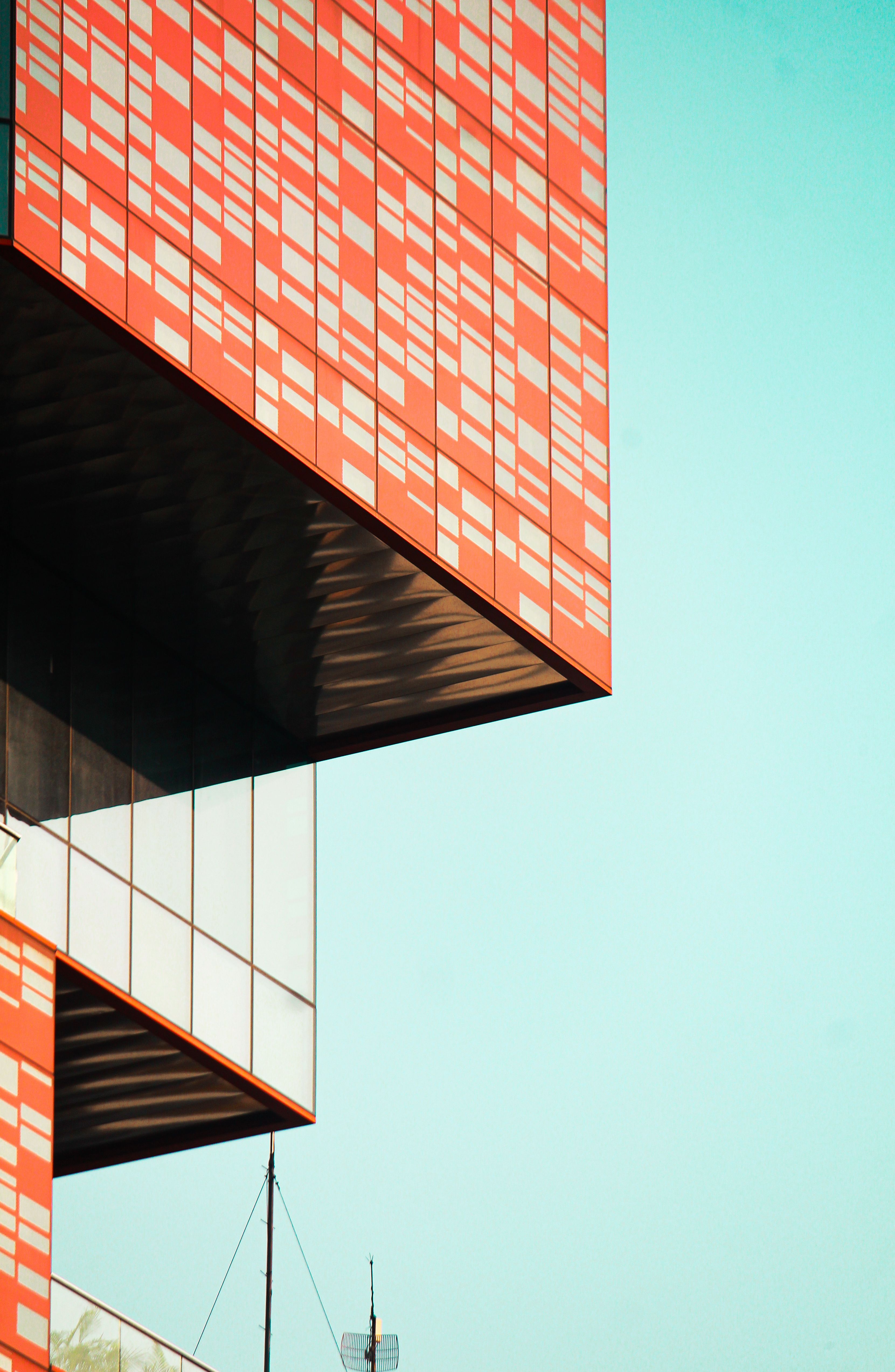 Modern Architectural Facade with Geometric Design · Free Stock Photo