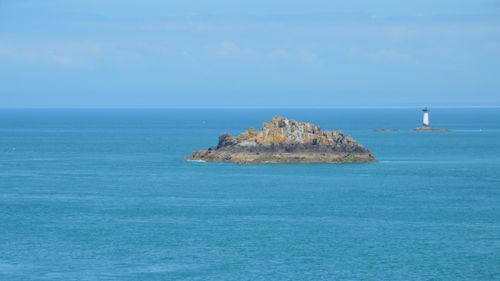 Free Beautiful view of an island and lighthouse in Cancale, Bretagne, France. Stock Photo