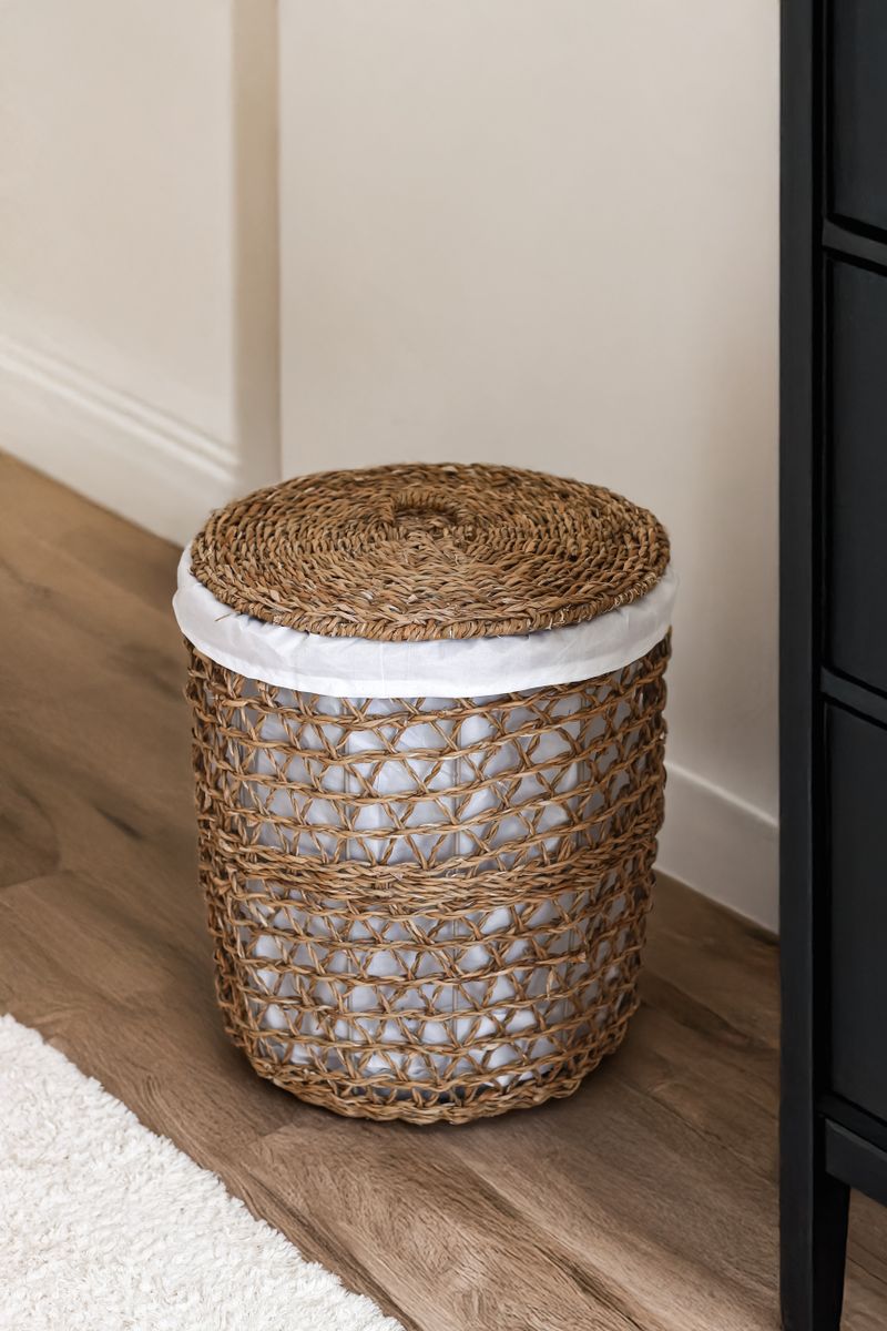 Lidded wicker storage basket in a modern living room